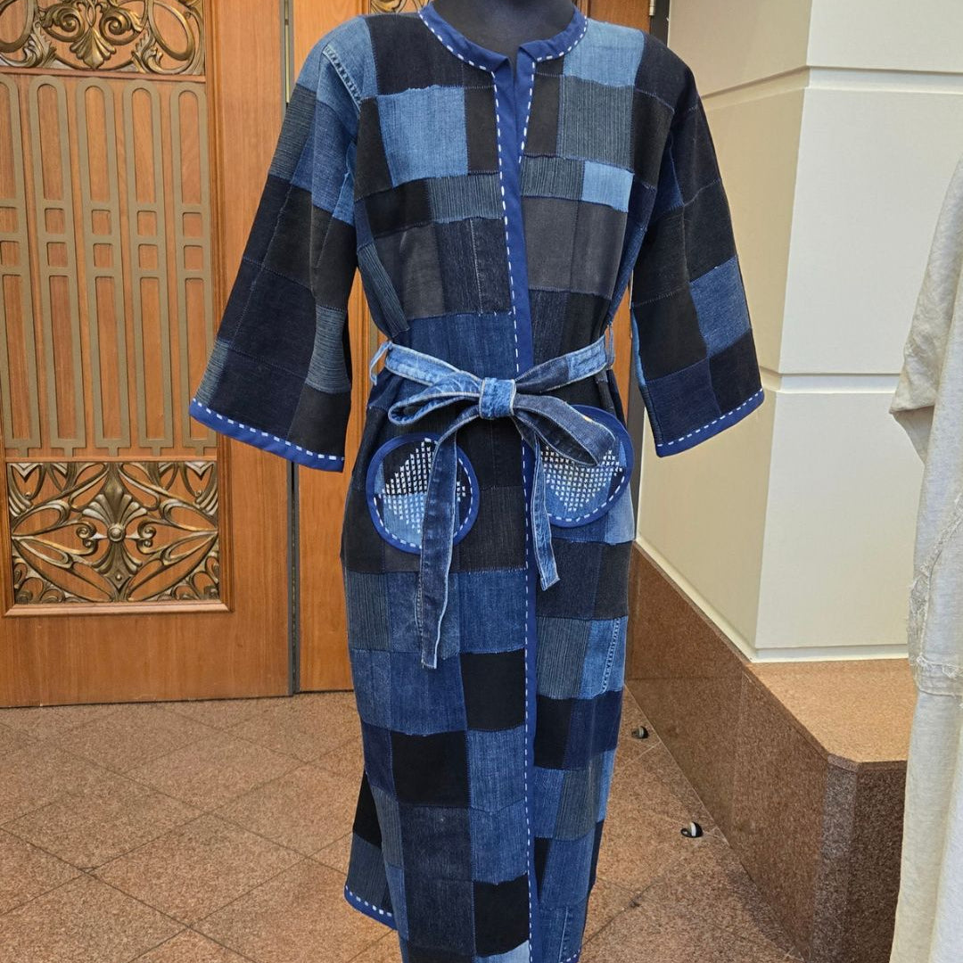 Blue checkered robe on a mannequin against a wooden door background